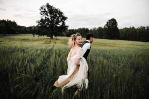 bride and groom in grass, portapixie events